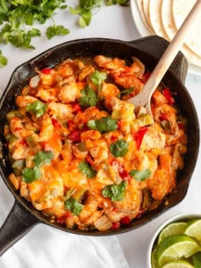 Chicken fajita casserole in a skillet.