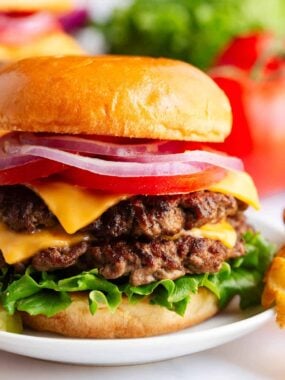 A smash burger on a plate.