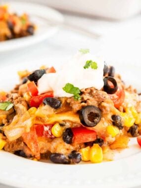 Mexican lasagna on a white a plate.