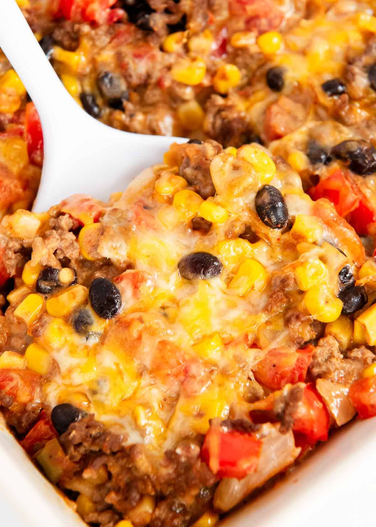 Mexican lasagna in a casserole dish.