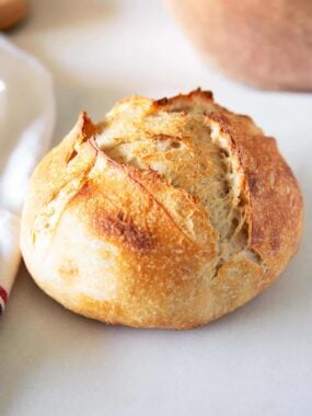 Sourdough bread loaf on counter.