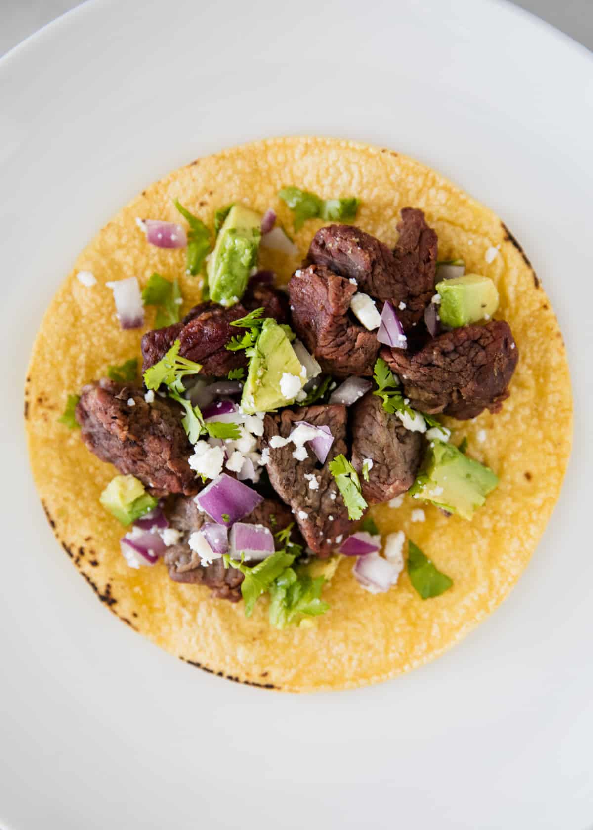Steak taco on a tortilla.
