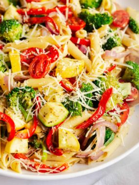 A close up photo of pasta primavera. .