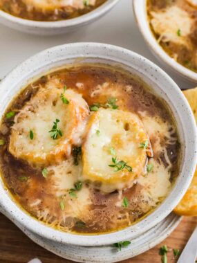 French onion soup in a white bowl.