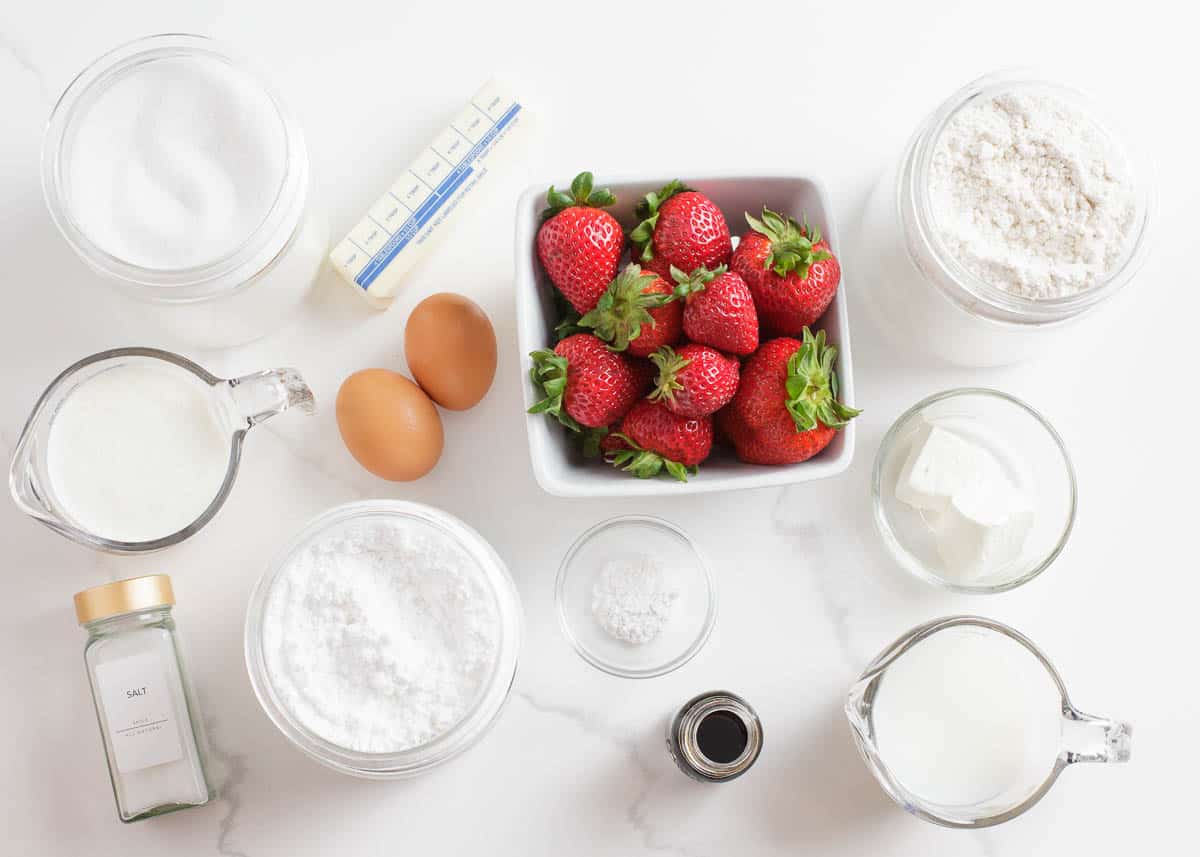 Strawberry shortcake ingredients on the counter.