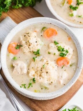 Chicken dumplings soup in a bowl.