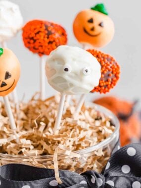 Close up of Halloween cake pop decorated as a mummy in a glass jar.