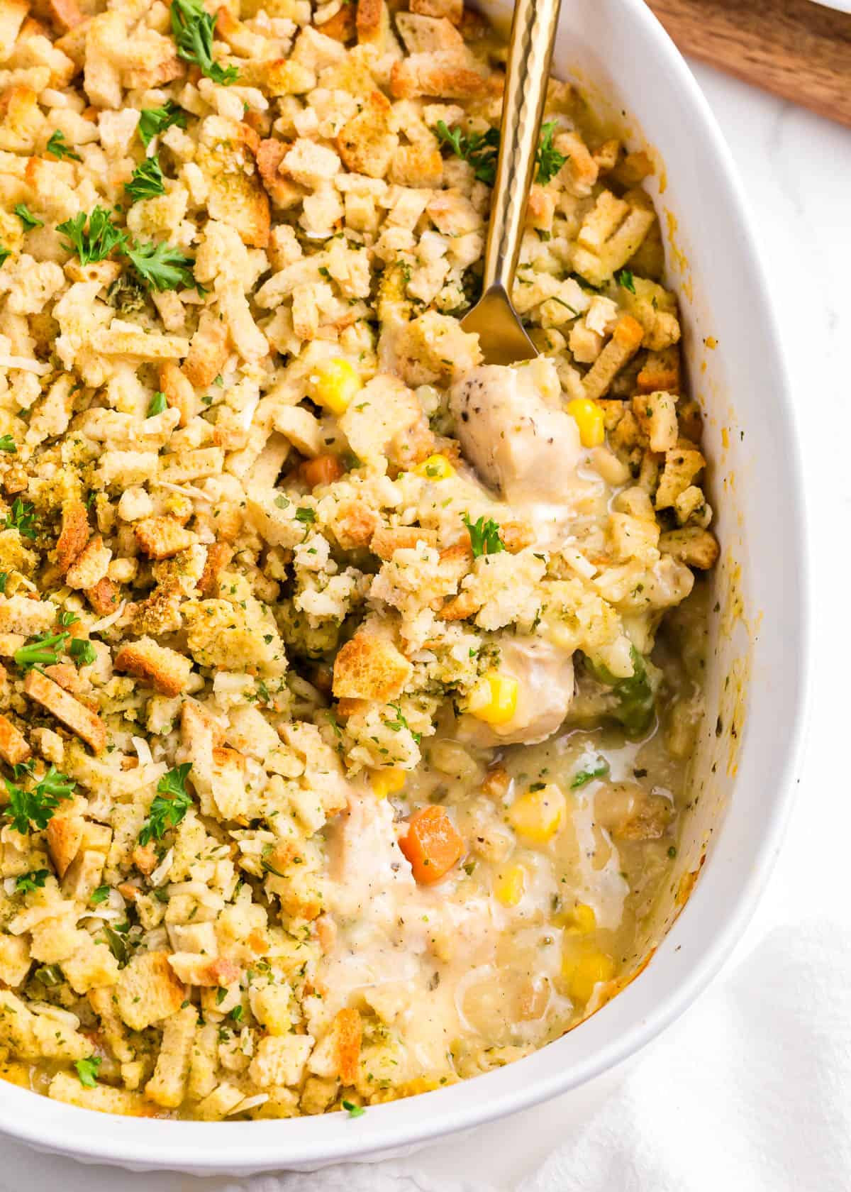 Chicken and stuffing casserole with spoon.
