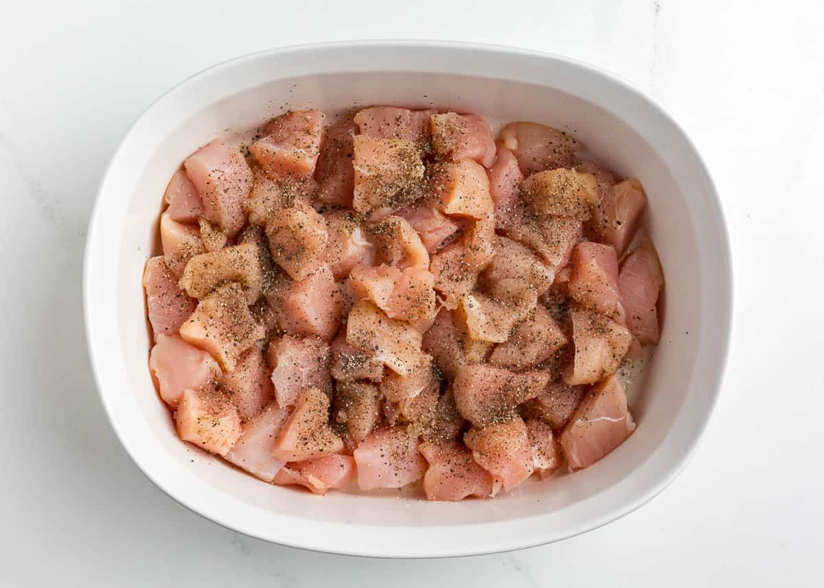 Diced chicken in a baking dish.