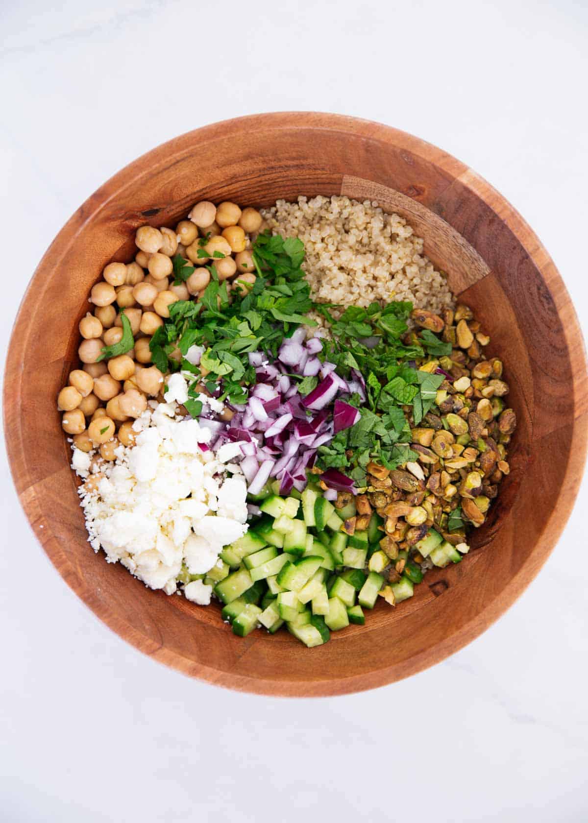 Showing how to make Jennifer Aniston salad in a large bowl.
