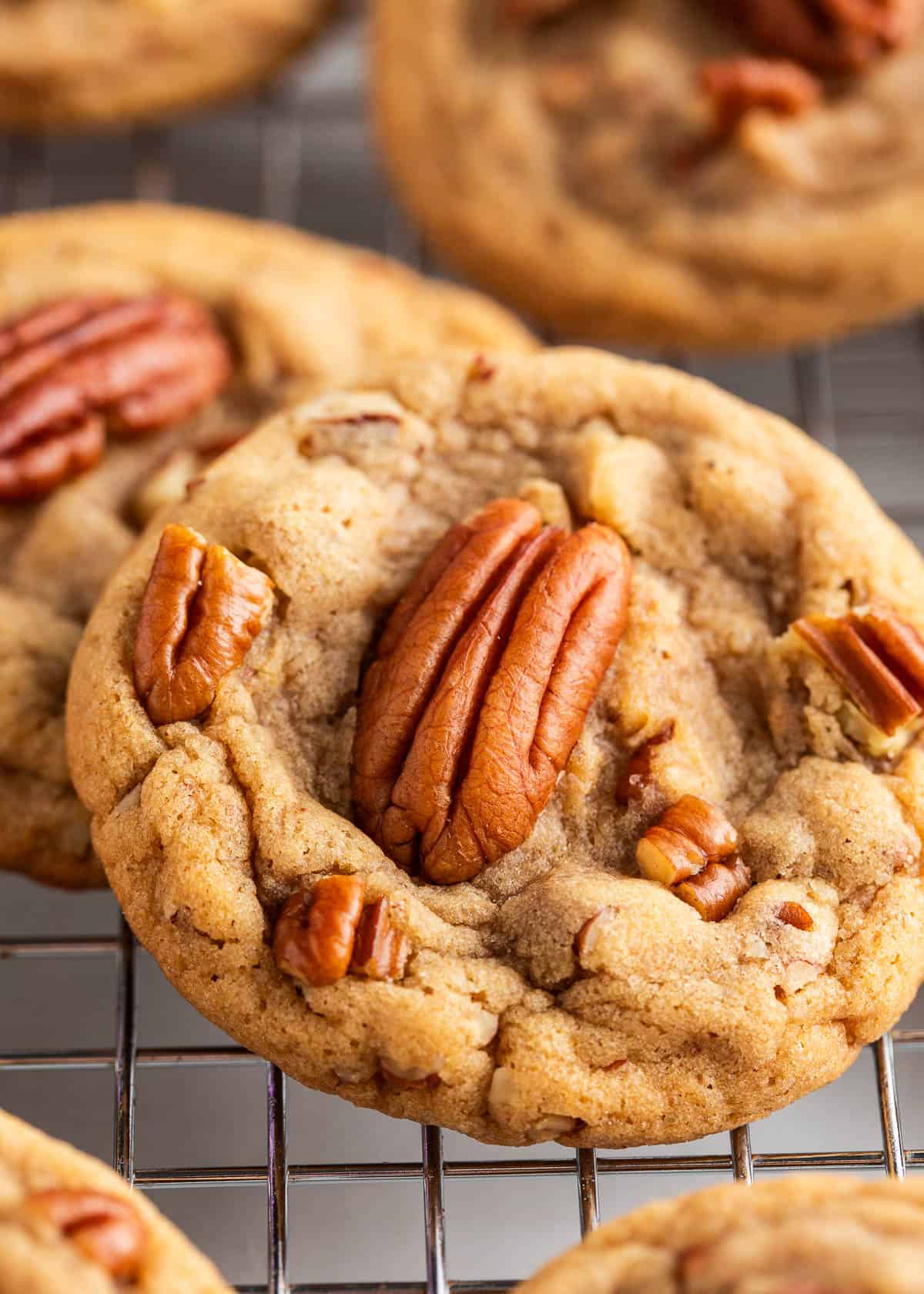 Butter pecan cookies on a cooling rack.