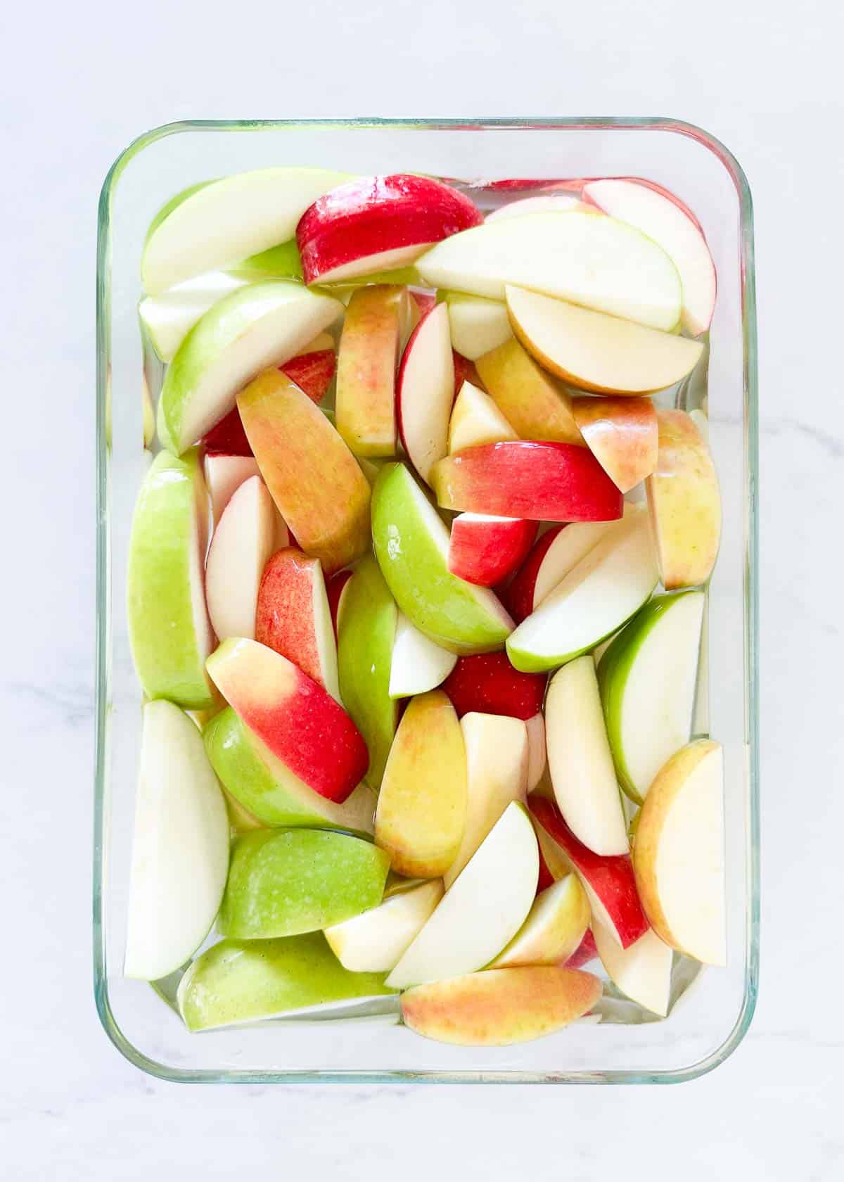 Sliced apples in a container.
