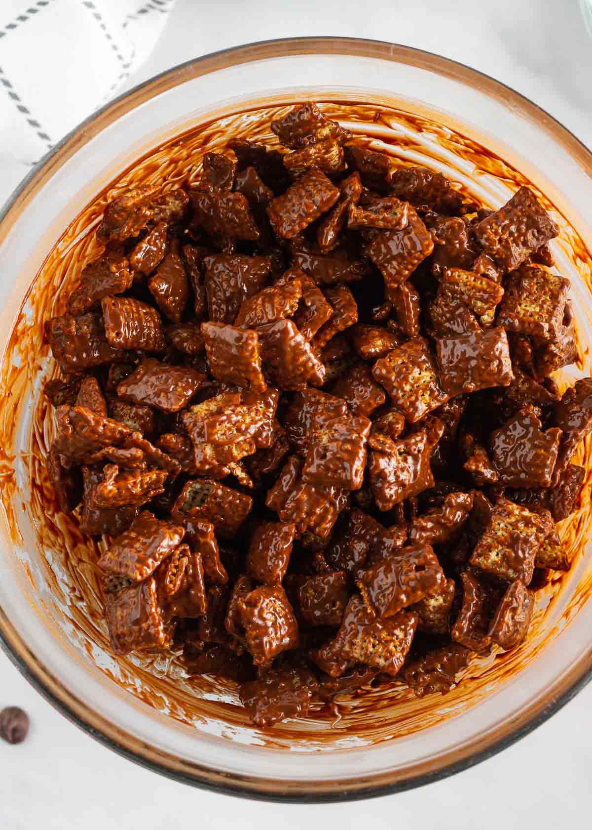 Showing how to make puppy chow in a bowl.