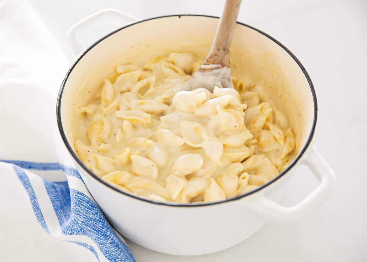 A pot on the stove filled with Panera mac and cheese. 