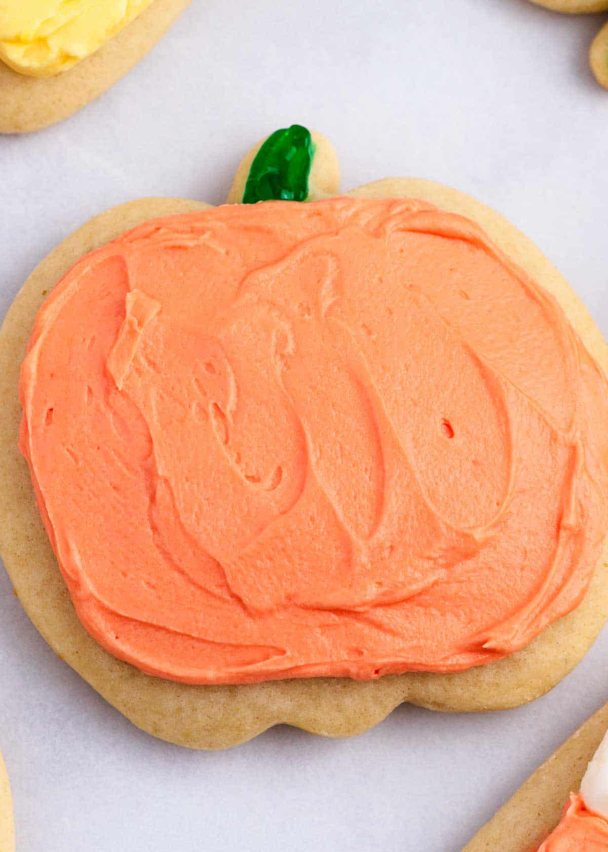 Pumpkin cut-out cookies on the counter for Halloween.