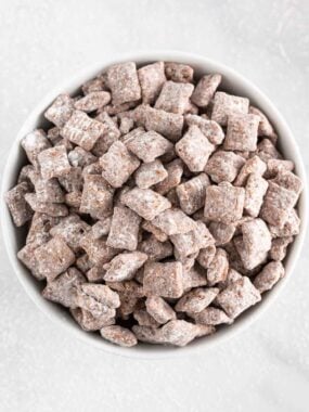 Puppy chow in a white bowl.