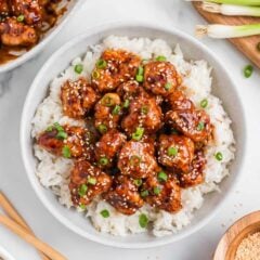Sesame chicken and rice in a bowl.