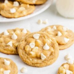 Stacked white chocolate chip cookies.