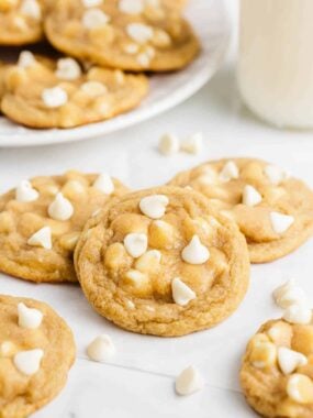 Stacked white chocolate chip cookies.