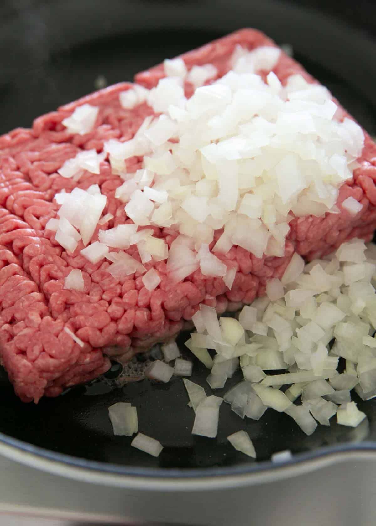 Cooking hamburger and onions.
