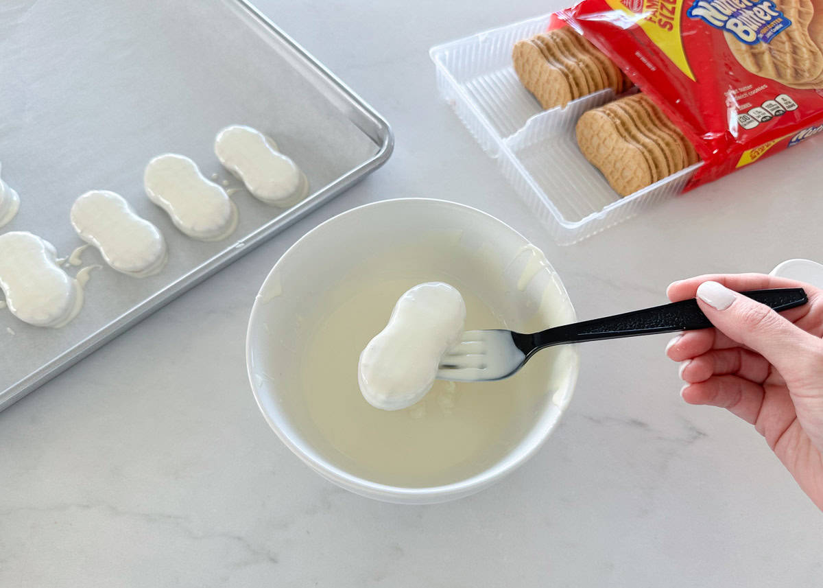 Showing how to make mummy cookies.