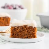 Slice of gingerbread cake with frosting.