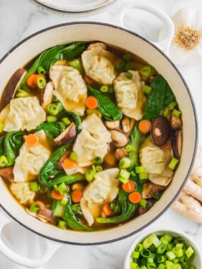 A large pot of potsticker soup.