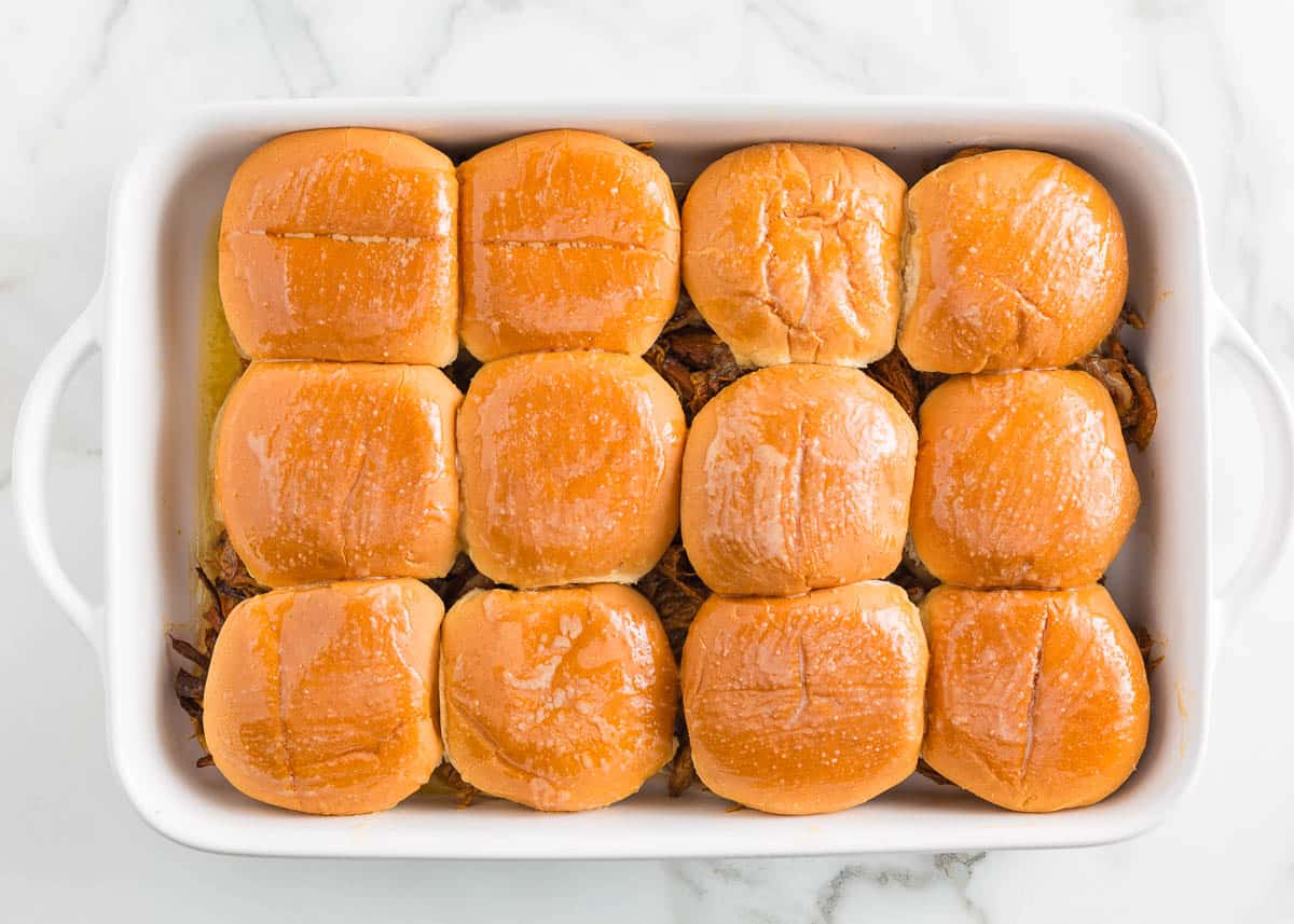 Pork sliders in baking dish.