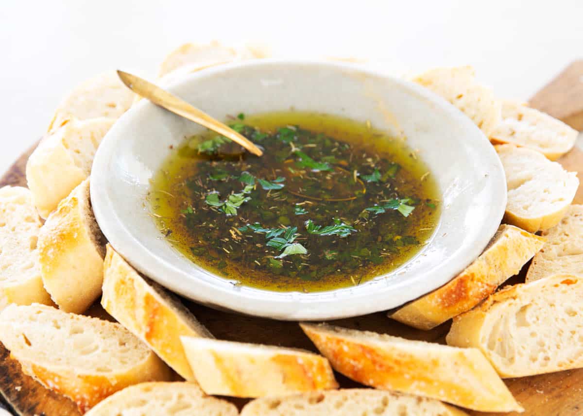 Bread dipping oil with sliced bread.