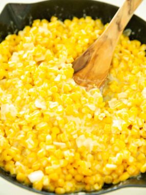 Creamed corn in a skillet.