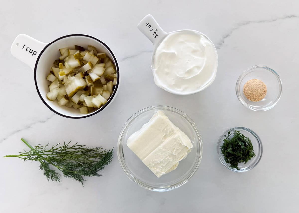 Dill pickle dip ingredients on the counter.