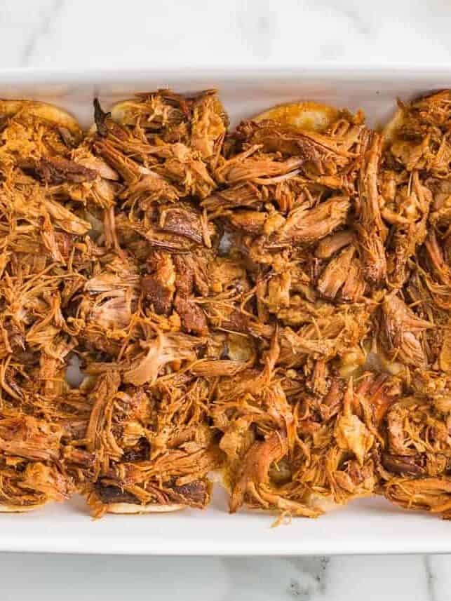 Pulled pork in a casserole dish.