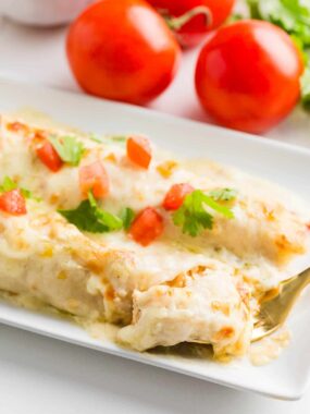 White chicken enchiladas on a plate.