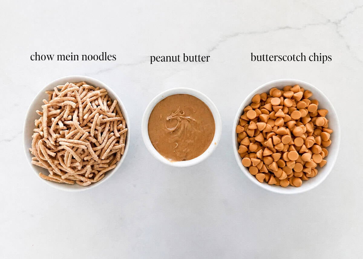 This haystacks recipe is an easy no-bake cookie made with butterscotch chips, peanut butter and chow mein noodles! This vintage treat is a favorite with sweet and salty taste. Haystacks recipe ingredients on counter including chow mein noodles, butterscotch chips and peanut butter.