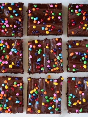 Three rows of sliced homemade cosmic brownies.