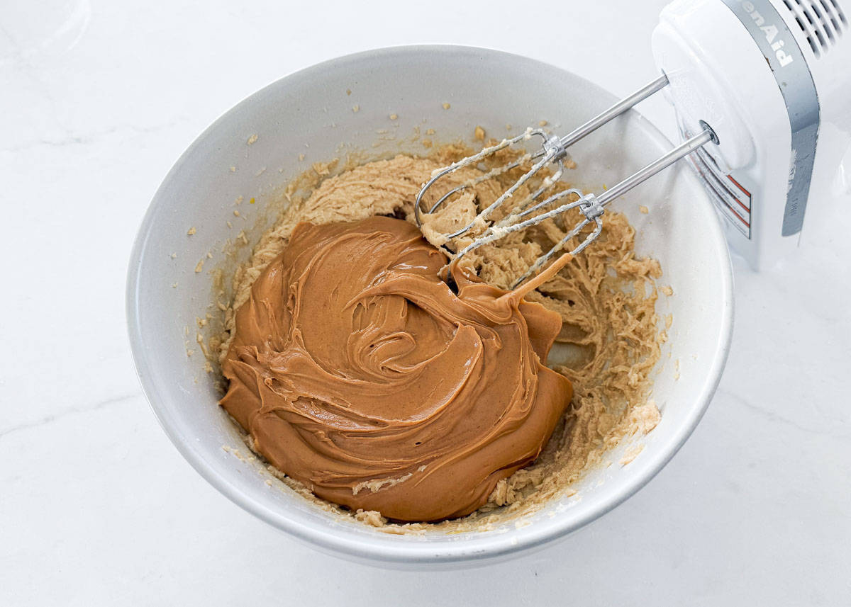 A bowl of creamed butter, sugar and peanut butter.