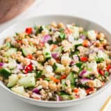 Bulgur salad in white bowl.
