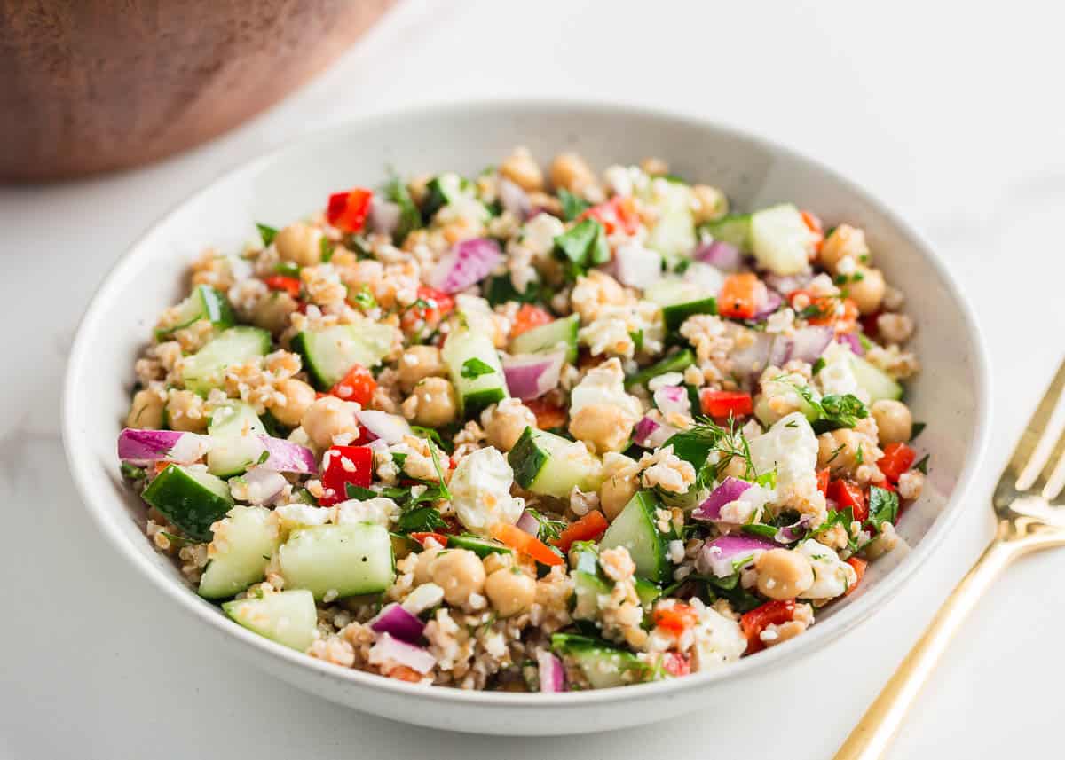Bulgur salad in white bowl.