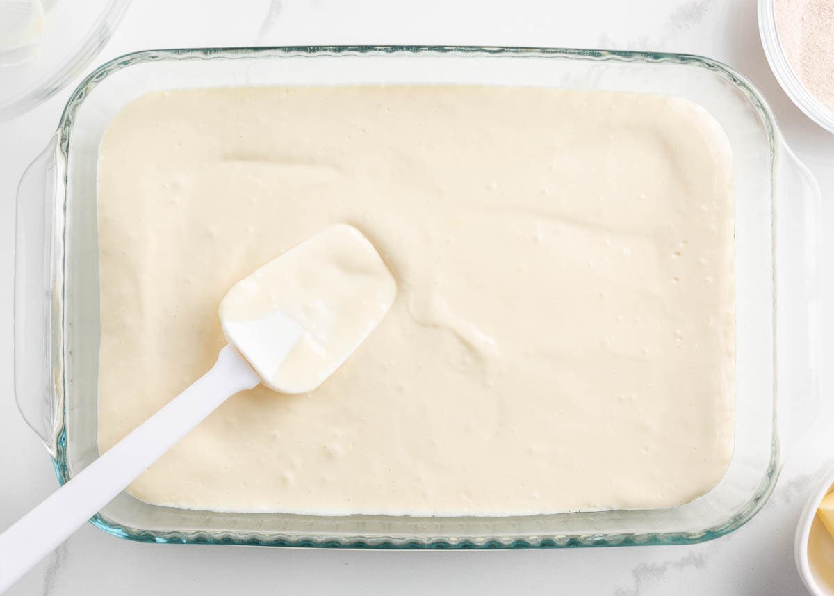 Showing how to make sopapilla cheesecake bars.
