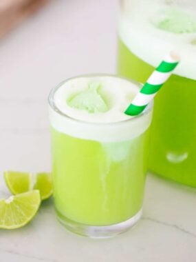 Green punch in a glass cup.
