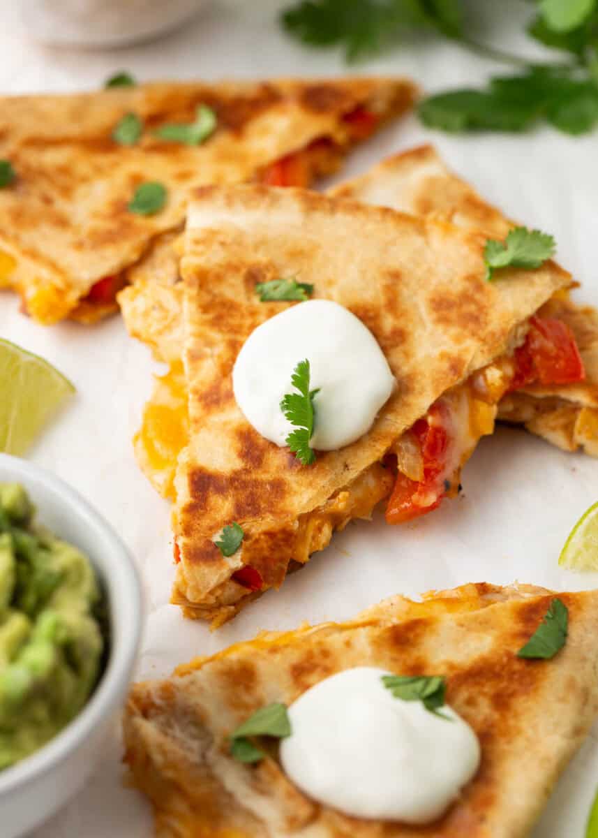 Chicken quesadilla cut into pieces on the counter.