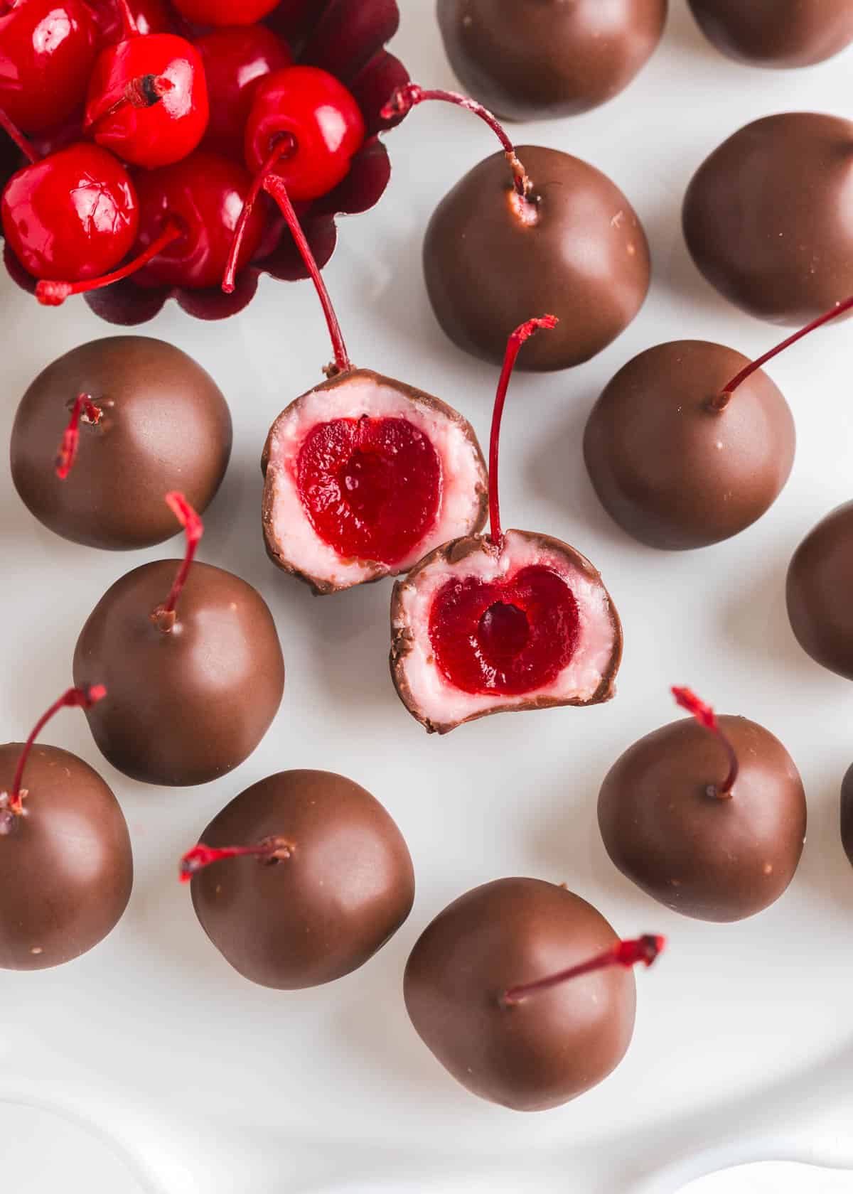 These chocolate covered cherries are an easy homemade candy made with maraschino cherries covered in chocolate. Biting into the liquid center of a cordial cherry is heavenly! Chocolate covered cherries.