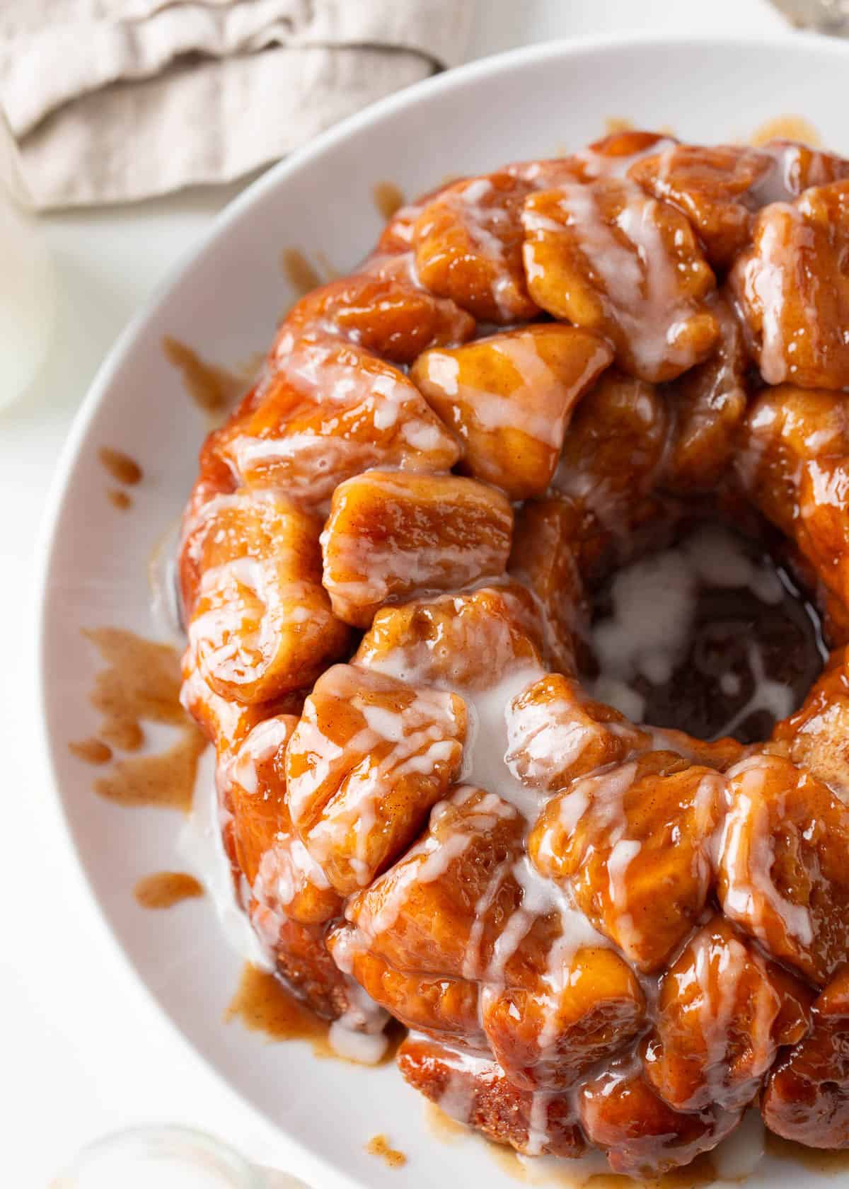 Monkey bread with a glaze on a plate. 