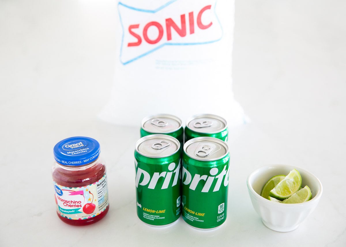 This copycat recipe for Sonic cherry limeade is easy to make with 7Up lemon lime soda, maraschino cherries and a lime wedge. This family friendly drink is a sweet treat! Cherry limeade ingredients.