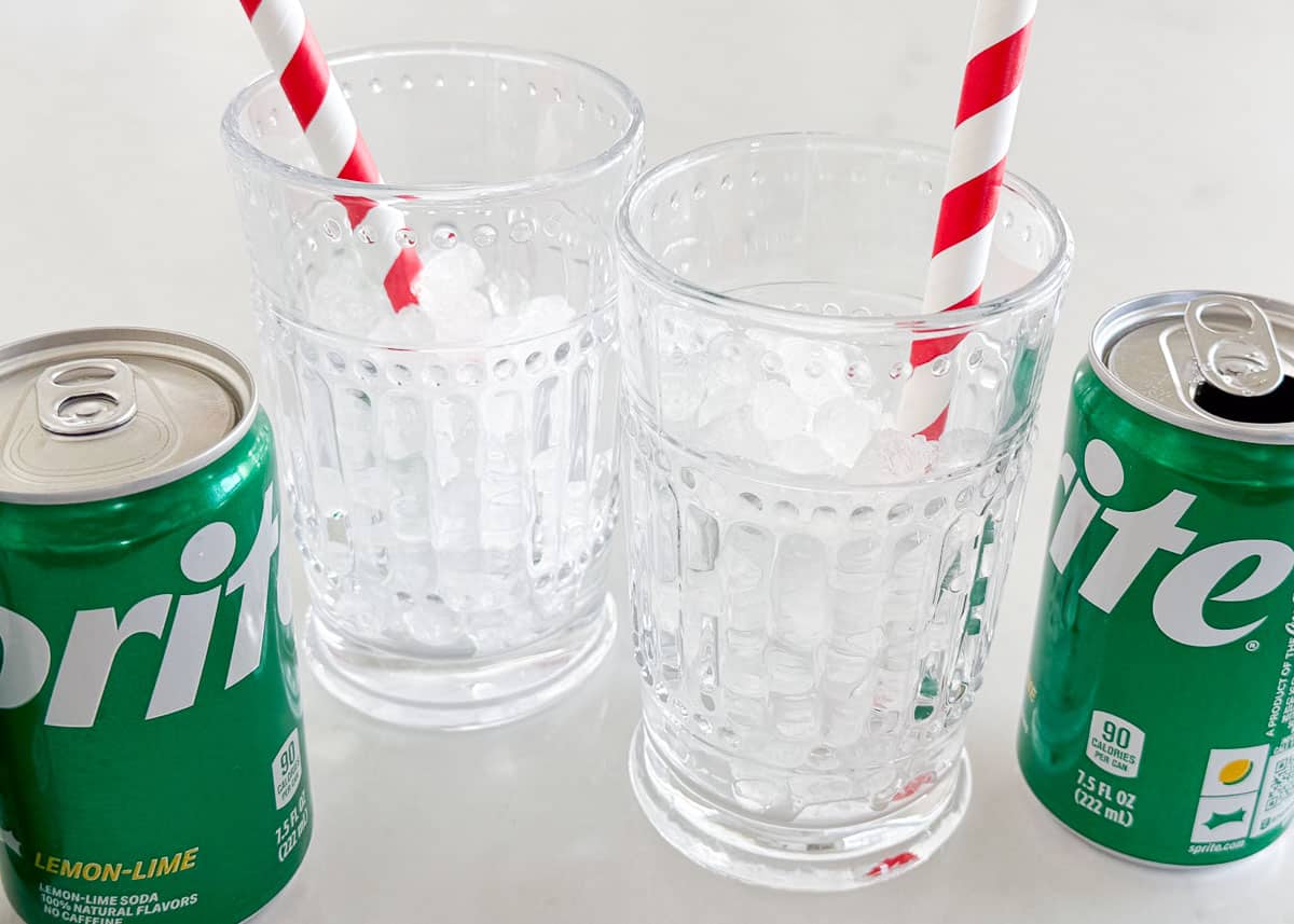 This copycat recipe for Sonic cherry limeade is easy to make with 7Up lemon lime soda, maraschino cherries and a lime wedge. This family friendly drink is a sweet treat! Showing how to make cherry limeade.