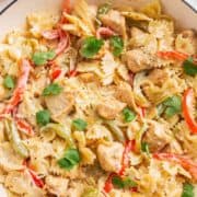 Chicken fajita pasta in white pot.