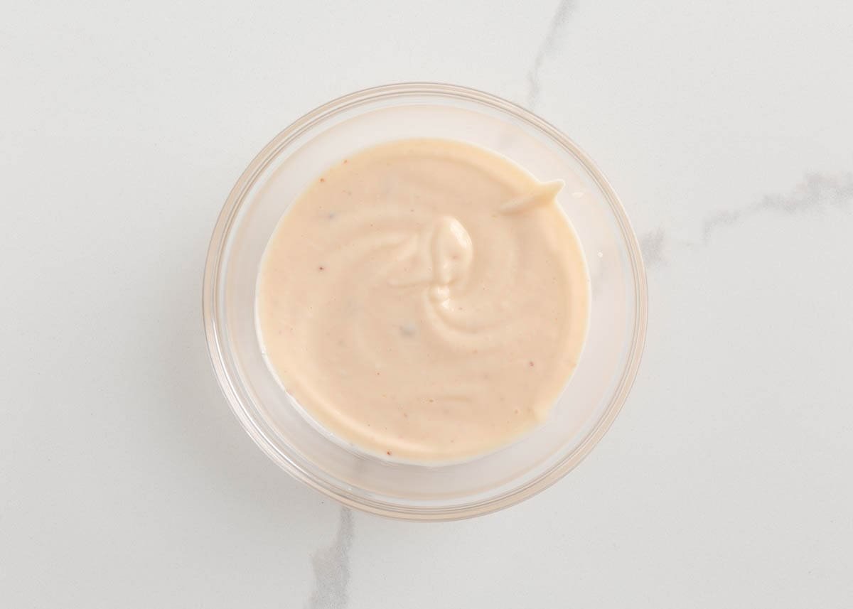 Dipping sauce for coconut shrimp in a bowl.