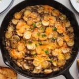 Ground beef and potatoes in a skillet.