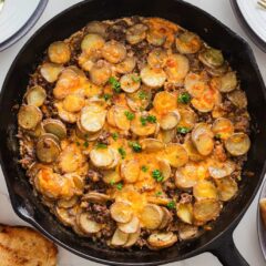 Ground beef and potatoes in a skillet.