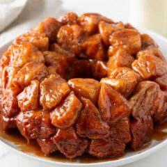 Monkey bread made with Grands biscuits coated in cinnamon sugar and baked until gooey for a breakfast treat.